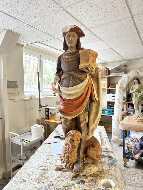 Atelier Giordani - Conservation - Restauration
Edifice – Mobilier - Sculpture – Objets d’art – Moulage –
Pierre, bois métal, polychromie et dorure - Restauration et dégagement de la statue de Saint Adrien - Pierre polychrome - - Traitement du support
- Dépoussiérage	
- Dégagement de polychromie	
- Refixage polychromie	
- Nettoyage	
- Masticage	
- Retouche et réintégration colorée